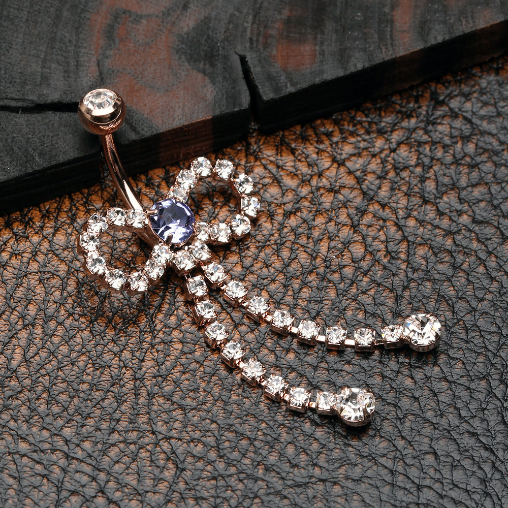 Detail View 2 of Rose Gold Radiant Sparkles Bow-Tie Belly Button Ring-Clear Gem/Tanzanite
