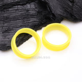 Detail View 1 of A Pair of Ultra Flexible Pastel Yellow Silicone Double Flared Tunnel Plug