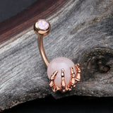 Detail View 2 of Rose Gold Rose Quartz Stone Orb Shine Skeleton Hand Belly Button Ring