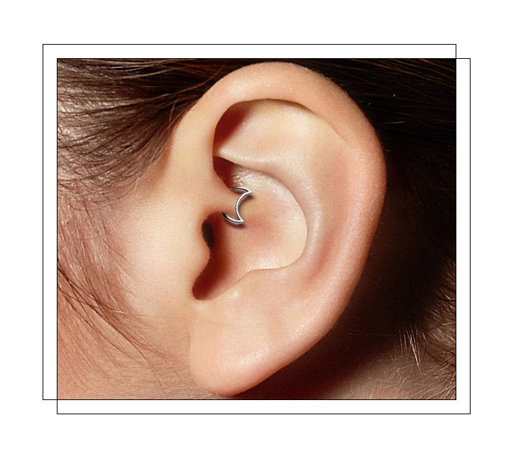 Located on the thick part of the cartilage in the inner ear in line with the tragus. The area is often referred to as the crux of the helix. It’s also the hoop that hugs the cartilage on the inside of your ear. It is the innermost (and smallest) fold of cartilage in the ear found directly where the inner ear above the canal touches the outer ridge of the ear. Daith piercings tend to take slightly longer than other piercings to heal.