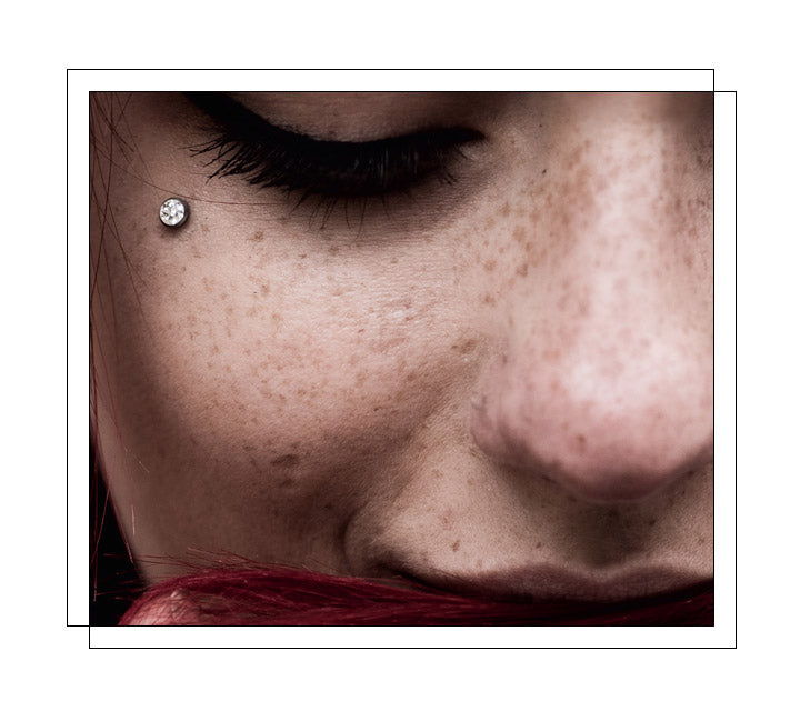 A single-point piercing in which a micro dermal anchor is placed underneath the skin and slid into place. The top is then secured to the part of the anchor that is visible, and almost flush with the skin. Dermals do not have a separate entry and exit point for jewelry, unlike traditional piercings. Often placed anywhere on the body, including the face, neck, chest, arms, and hands.