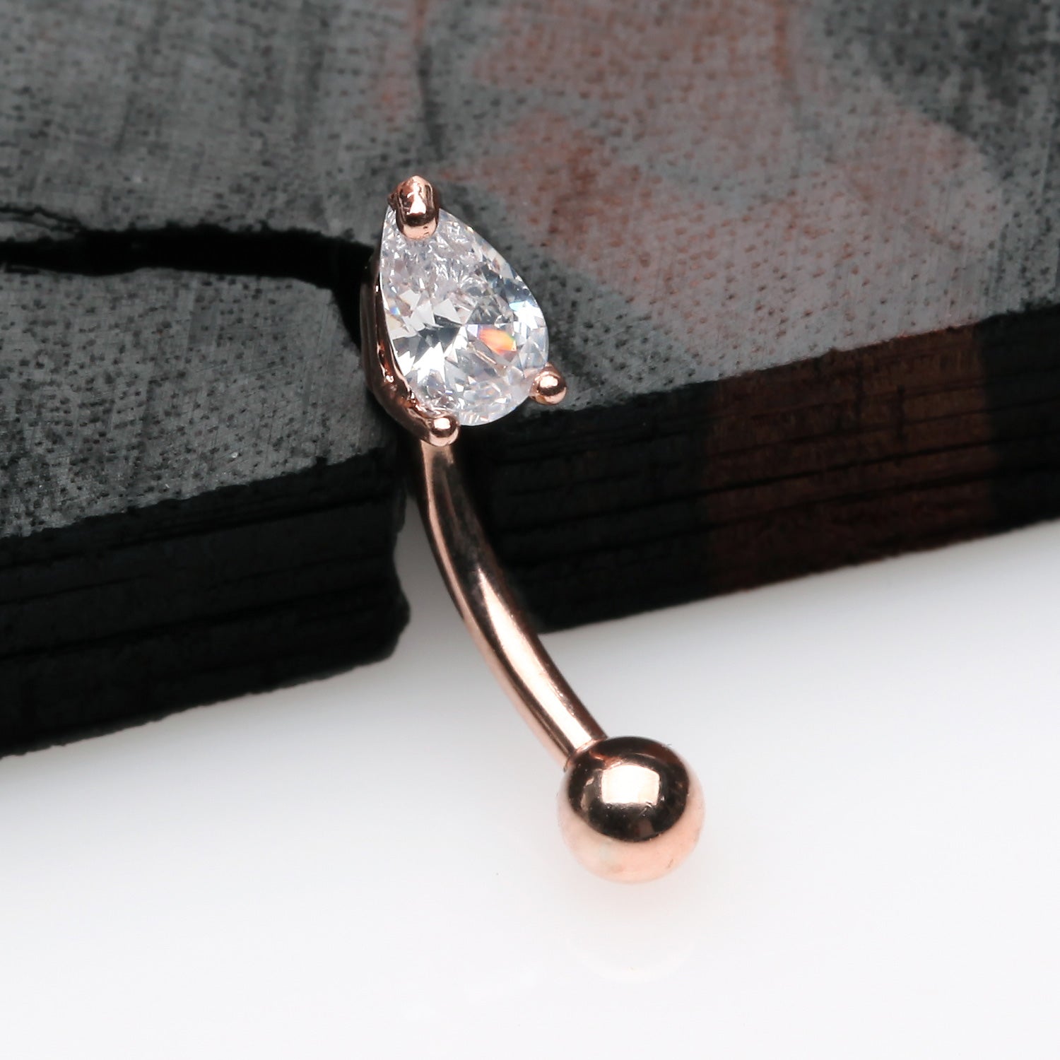 Detail View 1 of Rose Gold Teardrop Gem Sparkle Prong Set Curved Barbell-Clear Gem