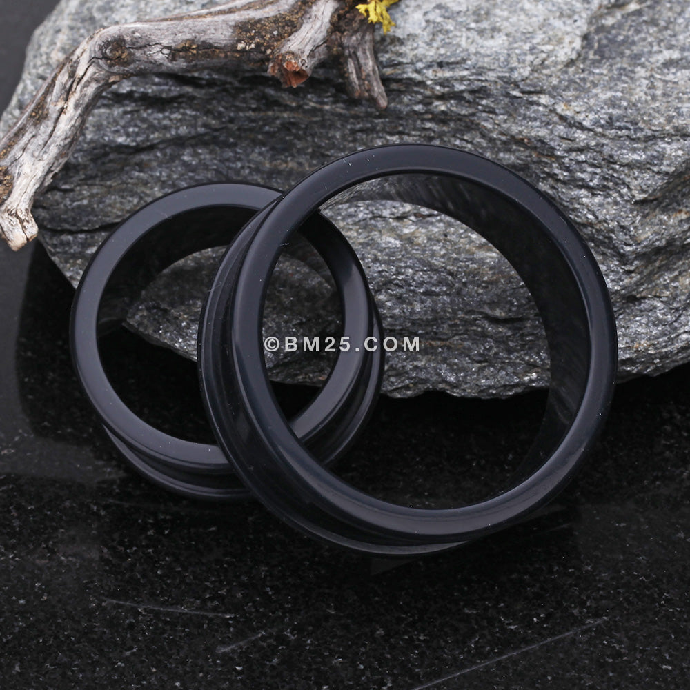 A Pair of Flexible Silicone Double Flared Ear Gauge Tunnel Plug