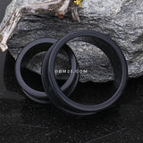 A Pair of Flexible Silicone Double Flared Ear Gauge Tunnel Plug