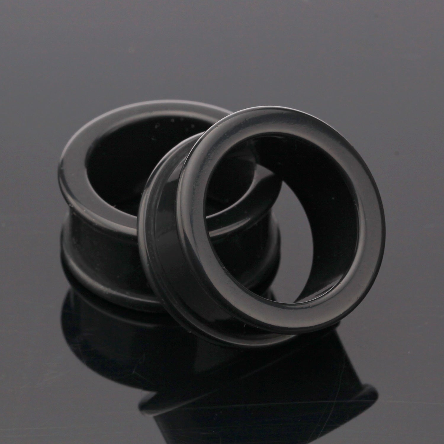 A Pair of Flexible Silicone Double Flared Ear Gauge Tunnel Plug