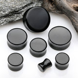 Detail View 2 of A Pair of Solid Black Flat Glass Double Flared Plug-Black