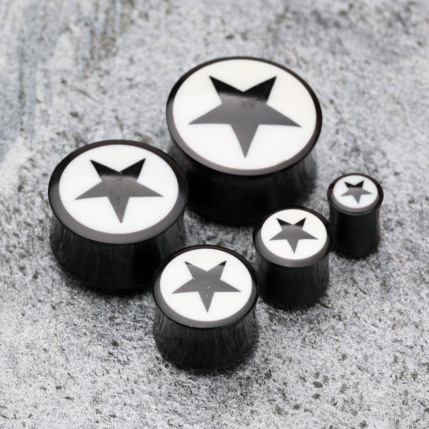 Detail View 1 of A Pair of Organic Horn Nova Star Ear Gauge Plug-Black