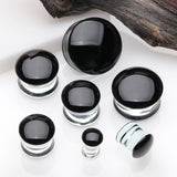 Detail View 2 of A Pair of Convex Black Front Glass Double Flared Ear Gauge Plug