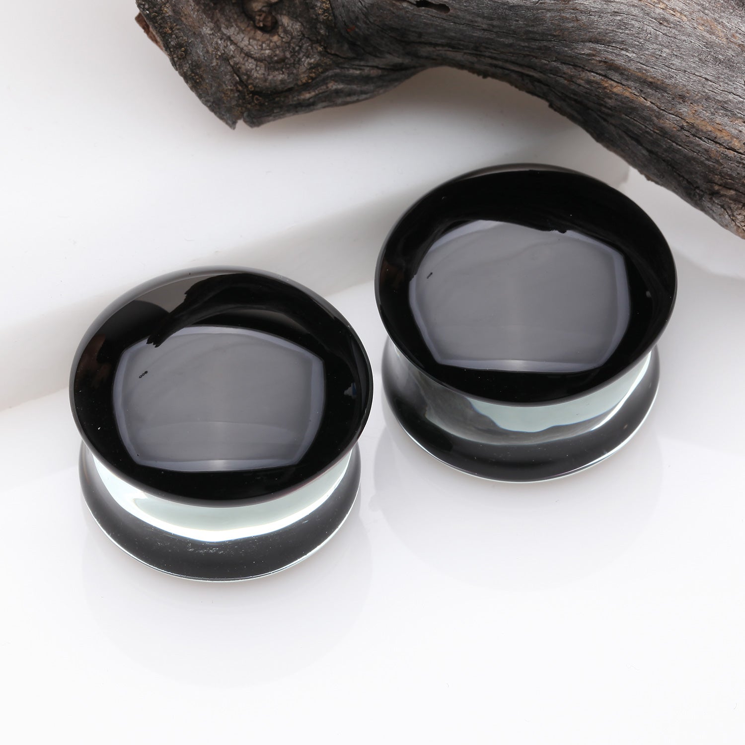 Detail View 1 of A Pair of Convex Black Front Glass Double Flared Ear Gauge Plug