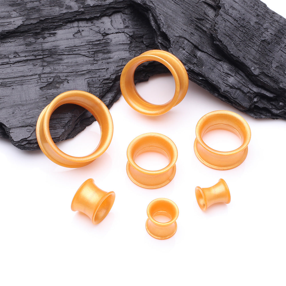 Detail View 2 of A Pair of Ultra Flexible Metallic Gold Silicone Double Flared Tunnel Plug