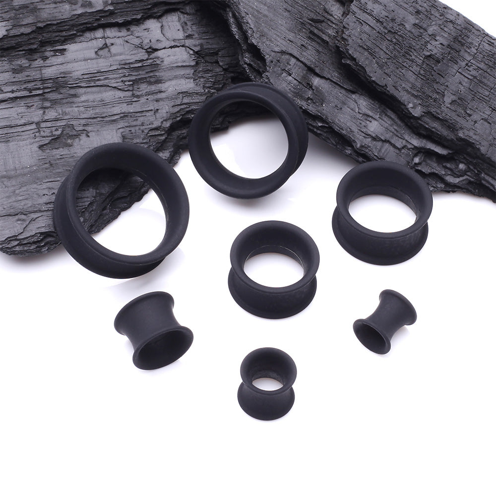 Detail View 2 of A Pair of Ultra Flexible Flat Black Silicone Double Flared Tunnel Plug