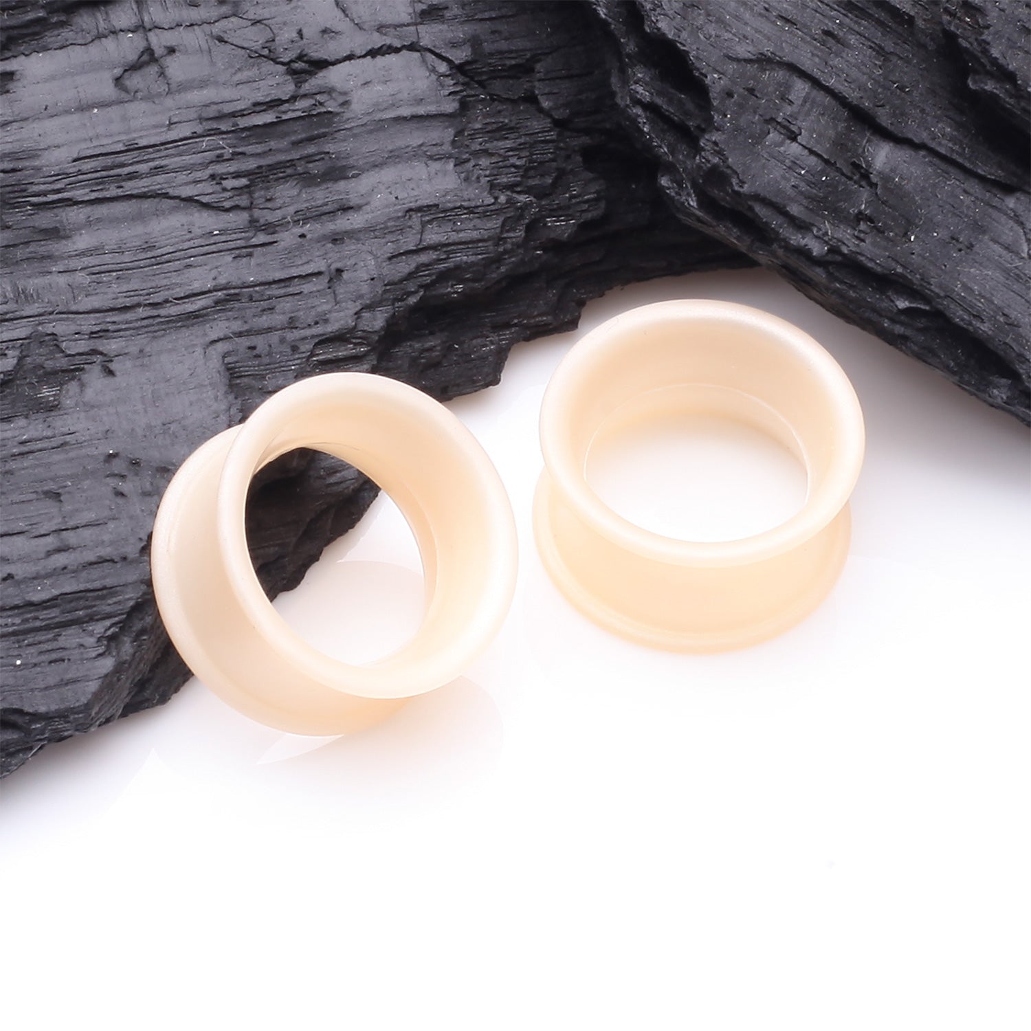 Detail View 1 of A Pair of Ultra Flexible Peach Silicone Double Flared Tunnel Plug