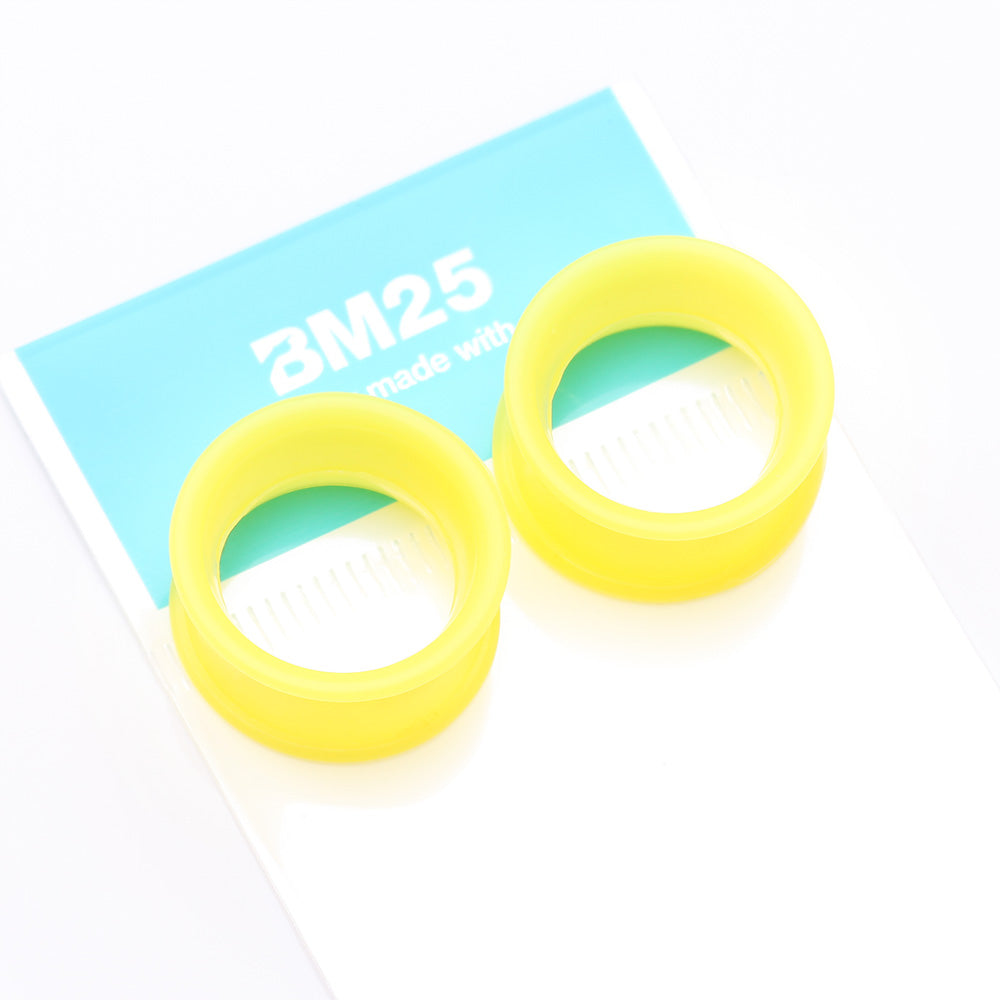 Detail View 4 of A Pair of Ultra Flexible Pastel Yellow Silicone Double Flared Tunnel Plug