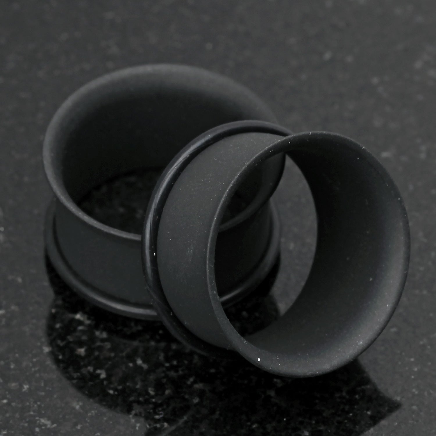 Detail View 1 of A Pair of Matte Black Steel Single Flared Ear Gauge Tunnel Plug-Black