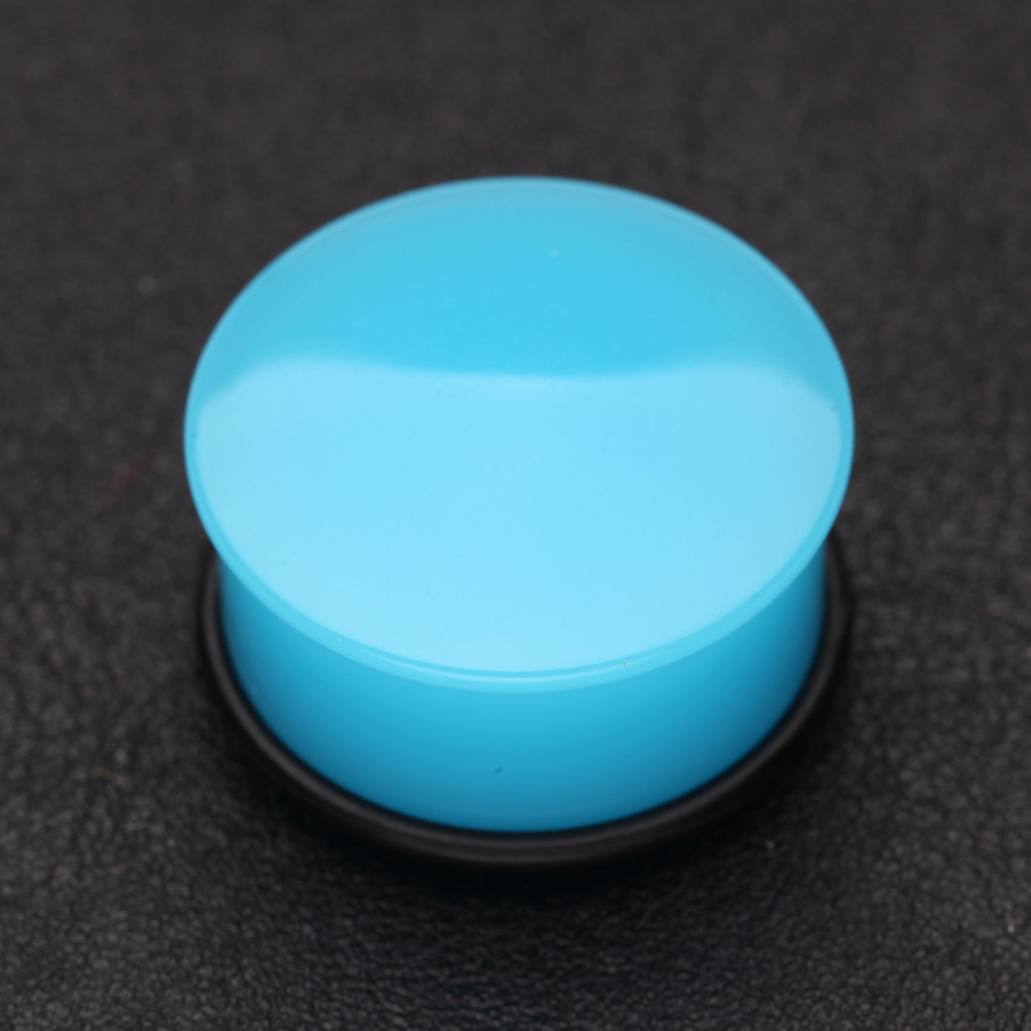 Detail View 1 of A Pair of Neon Colored UV Acrylic Single Flared Ear Gauge Plug-Light Blue