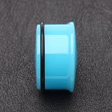 Detail View 2 of A Pair of Neon Colored UV Acrylic Single Flared Ear Gauge Plug-Light Blue