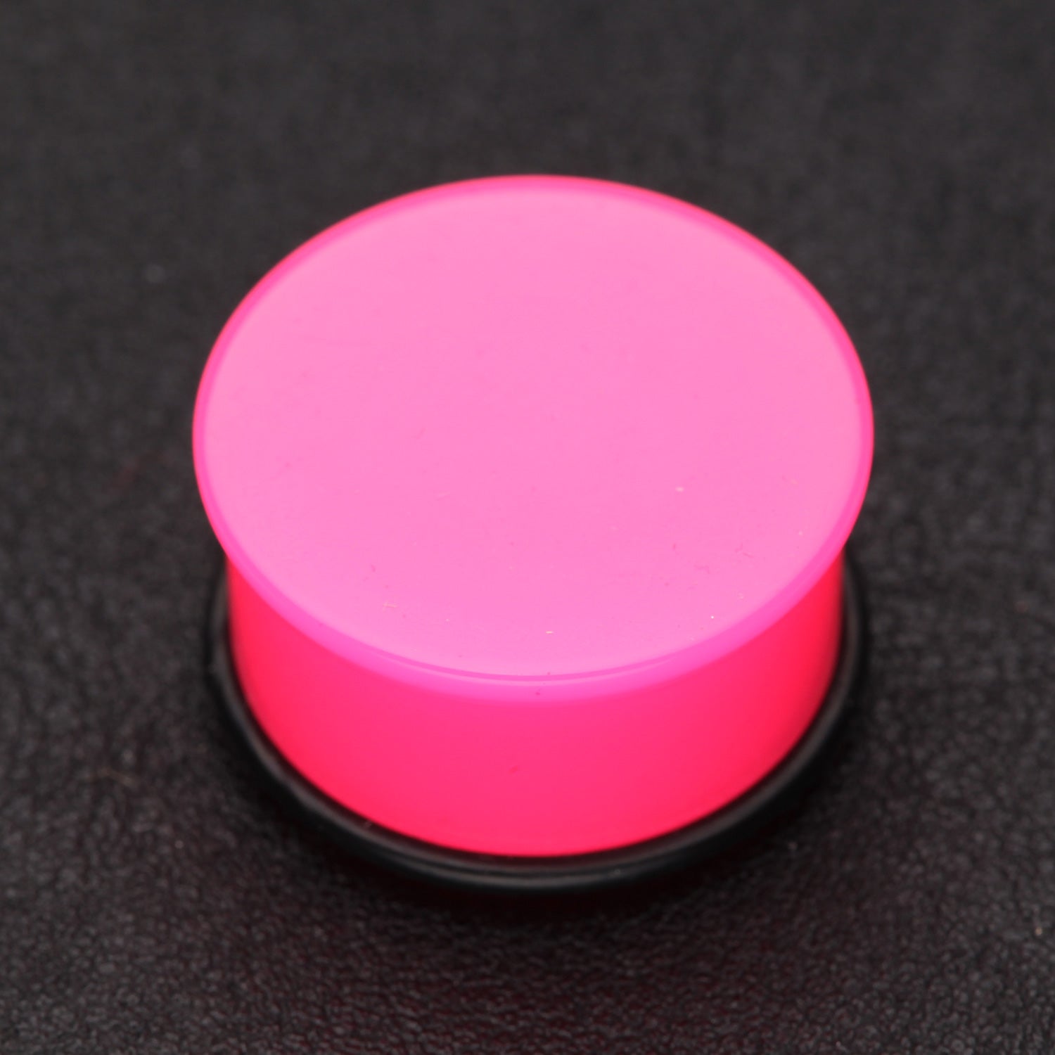 Detail View 1 of A Pair of Neon Colored UV Acrylic Single Flared Ear Gauge Plug-Pink