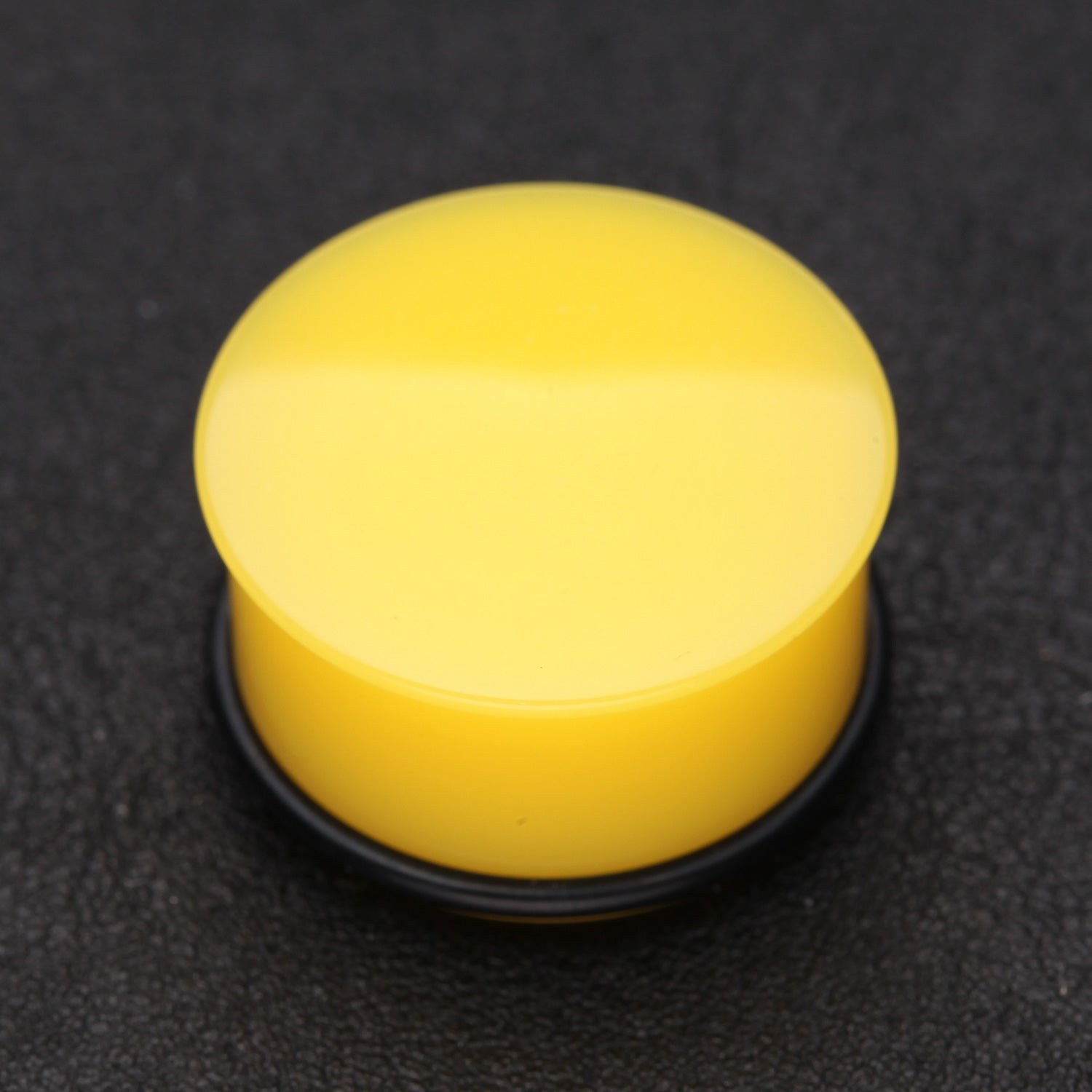 Detail View 1 of A Pair of Neon Colored UV Acrylic Single Flared Ear Gauge Plug-Yellow