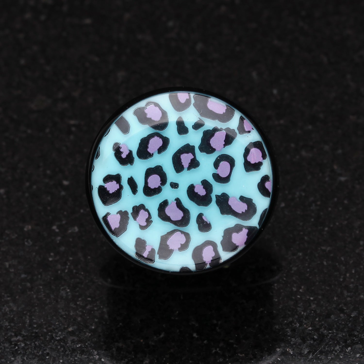Detail View 1 of A Pair of Glow in the Dark Cheetah Print Single Flared Ear Gauge Plug-Blue/Aqua