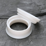 Detail View 4 of A Pair of Solid UV Smooth Flared Screw-Fit Ear Gauge Tunnel Plug-White