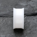 Detail View 2 of A Pair of Solid UV Smooth Flared Screw-Fit Ear Gauge Tunnel Plug-White