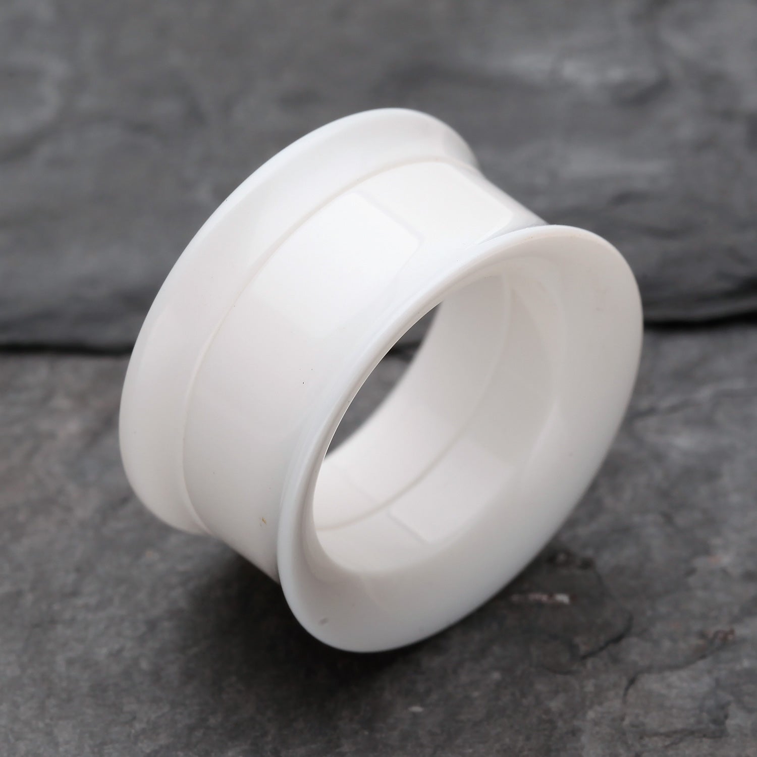 Detail View 1 of A Pair of Solid UV Smooth Flared Screw-Fit Ear Gauge Tunnel Plug-White