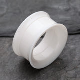 Detail View 1 of A Pair of Solid UV Smooth Flared Screw-Fit Ear Gauge Tunnel Plug-White