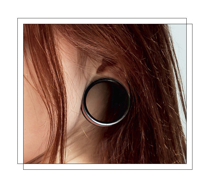 Located on the lower fleshy part of the earlobe, plug piercing typically starts out with an 18 gauge earlobe. Once the piercing is fully healed, gradually stretch to enlarge the hole. It is important to allow time to heal between stretches to the next size up to avoid any damage to the lobe, which may take 6-8 weeks between the stretch. We carry up to 3” plugs, so be sure to keep stretching if your heart desires.