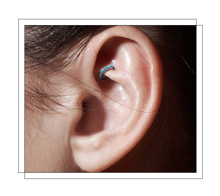 Located in the smaller fold of cartilage in the upper part of the ear. Also, known as the “perforation of the anti-helix” aka the cartilage ridge between the outer and inner ear above your tragus. Traditionally, a rook piercing is done vertically in the ear ridge so both sides of the jewelry are displayed. It’s essentially the sister to the daith piercing and the more pratical cartilage piercing.