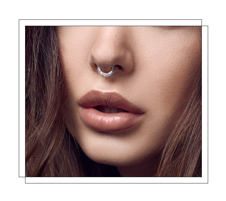 Located through the thin wall of cartilage that separates your left and right nostrils. It’s also one of the more common nose piercings. It’s often referred to as “the sweet spot”. Often referred to as a “bull ring” piercing. These piercings are wildly popular for how effortlessly cool they look! The septum piercing can be the biggest, extreme piercing; the small, delicate piercing; or it can be completely hidden when flipped!
