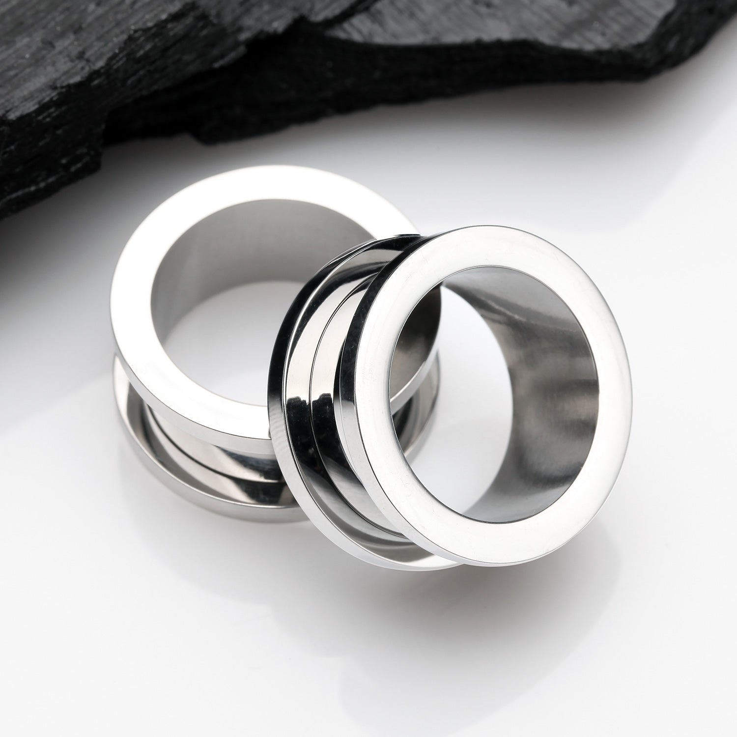 Detail View 1 of A Pair of Implant Grade Titanium Screw-Fit Tunnel Plug