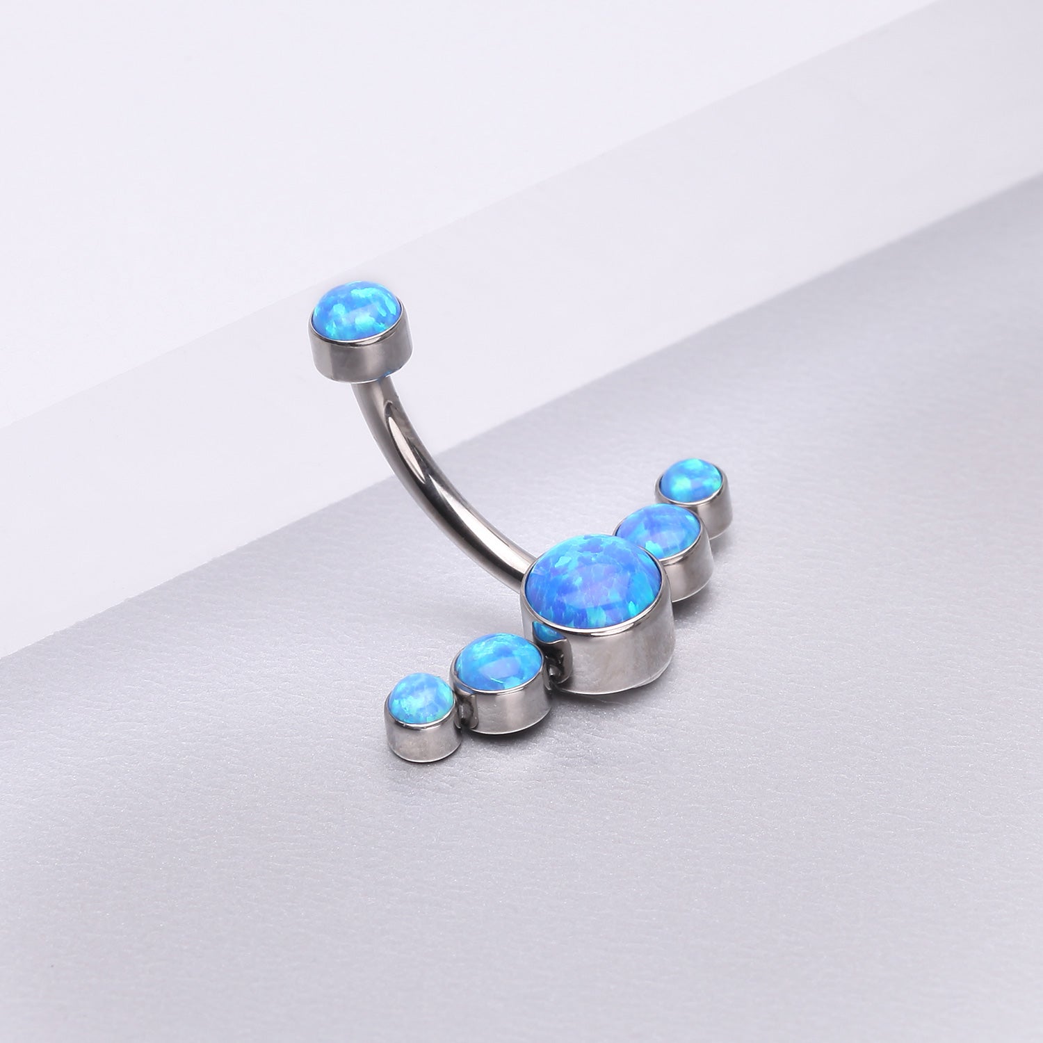 Detail View 1 of Implant Grade Titanium Internally Threaded Journey Curve Fire Opal Sparkle Belly Button Ring-Blue Opal