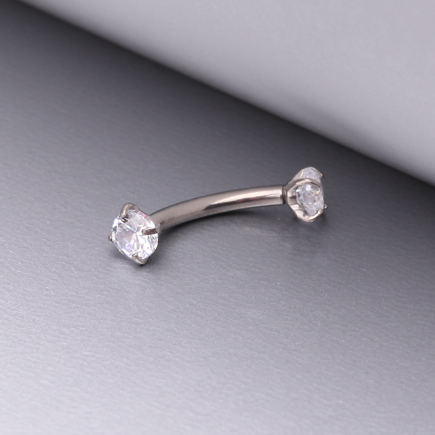 Detail View 1 of Implant Grade Titanium Prong Set Gem Sparkles Internally Threaded Curved Barbell-Clear Gem