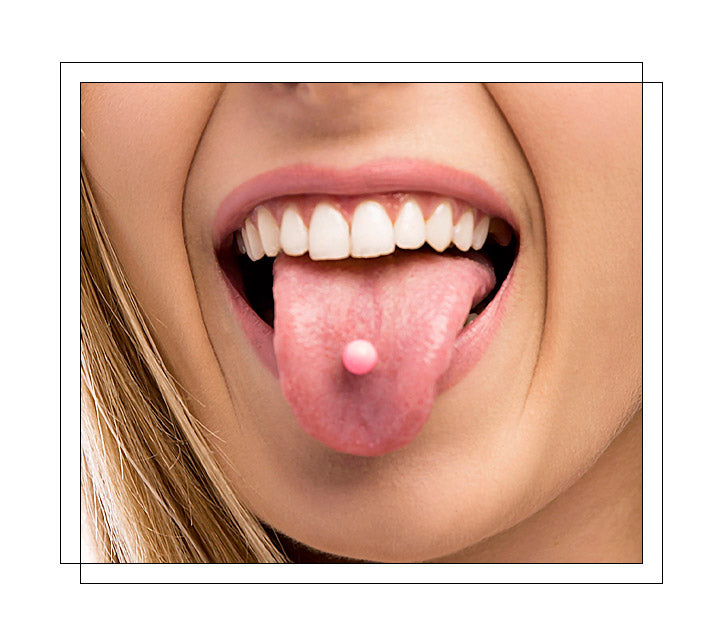 Located through the tongue’s thickest parts. The most common is the midline piercing, a vertical piercing involving a needle going straight through at one point from top to bottom in the center of the tongue. There are several different tongue piercings in addition to the midline piercing: horizontal, snake eyes, frenulum, venom, and surface tongue piercing.