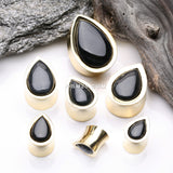Detail View 2 of A Pair of Golden Brass Bali Black Onyx Stone Inlay Teardrop Double Flared Plug