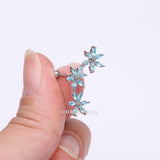 Detail View 2 of Grand Sparkle Triple Flowers Steel Cartilage Tragus Barbell Stud-Aqua