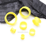 Detail View 2 of A Pair of Ultra Flexible Pastel Yellow Silicone Double Flared Tunnel Plug