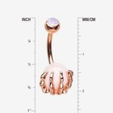 Detail View 1 of Rose Gold Rose Quartz Stone Orb Shine Skeleton Hand Belly Button Ring