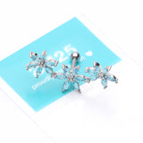 Detail View 3 of Grand Sparkle Triple Flowers Steel Cartilage Tragus Barbell Stud-Aqua