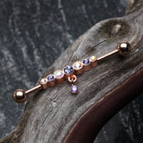 Detail View 1 of Rose Gold Dazzling Gem Row Sparkle Dangle Industrial Barbell-Tanzanite/Aurora Borealis