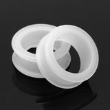 Detail View 1 of A Pair of Flexible Silicone Double Flared Ear Gauge Tunnel Plug-Clear Gem