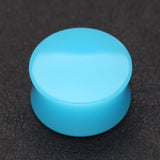 Detail View 1 of A Pair of Neon Colored UV Acrylic Double Flared Ear Gauge Plug-Light Blue