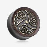 A Pair of Antique Triskelion Spiral Decorated Ebony Wood Double Flared Plug