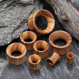 Detail View 2 of A Pair of Olive Wood Organic Double Flared Tunnel Plug-Orange/Brown