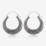 A Pair of Ancient Bali Ornate White Brass Loop Plug Hoop Earring