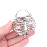 Detail View 2 of A Pair of Death's Arrival White Brass Rib Cage Skeletal Plug Hoop Earring
