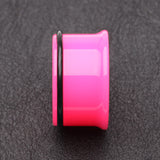 Detail View 2 of A Pair of Neon Colored UV Acrylic Single Flared Ear Gauge Plug-Pink