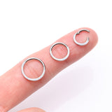 Detail View 3 of Implant Grade Titanium Brilliant Fire Opal Lined Front Facing Seamless Clicker Hoop Ring-White Opal