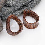 Detail View 1 of A Pair of Teardrop Coconut Wood Double Flared Tunnel Plug