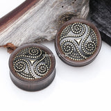 Detail View 1 of A Pair of Antique Triskelion Spiral Decorated Ebony Wood Double Flared Plug